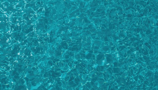 Wide shot of calm, clear blue water with ripples, ideal for editorial header background, World Oceans Day