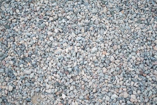 A background of small pebbles - Powered by Adobe