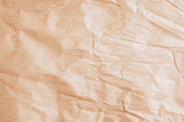 Wrinkled beige paper texture background with creases