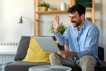 Young man attending an online course from home, learning new skills through virtual education