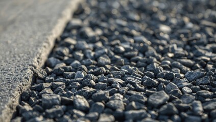 Detailed view of gray gravel stones typical for outdoor decoration and pathway construction, highlighting surface texture
