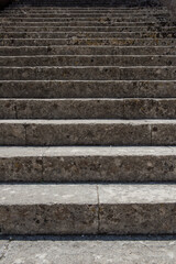 An upward view of a set of weathered stone steps