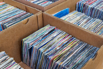 Boxes with vintage vinyl turntable records on a flee market