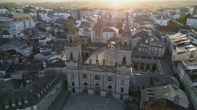 Historic city of Lugo in Galicia, Spain, Cathedral of Santa Maria de Lugo and ancient Roman Walls surrounding preserved medieval old town, European cultural heritage landmark. Aerial View