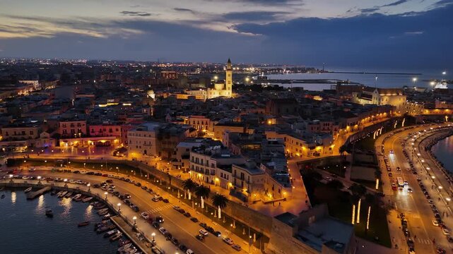 Aerial view of Bari old town and Adriatic coastline, Bari Vecchia historic district, Puglia region, southern Italy, Mediterranean coastal city, 4K footage