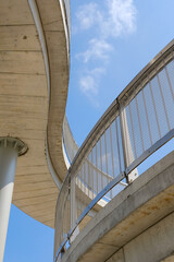 Curved concrete architecture against blue sky