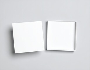Fototapeta premium Top Down View Of An Open White Square Box With Lid On A Neutral Gray Background