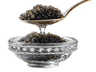 Black caviar in a silver spoon over a crystal bowl isolated on transparent or white background, png