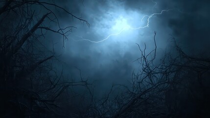 Gnarled dead tree branches silhouetted against a stormy night sky illuminated by a bright lightning strike