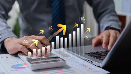 Businessman calculating financial interest with growth arrow, money and business investment analysis, profit increase, revenue planning and economic success concept.