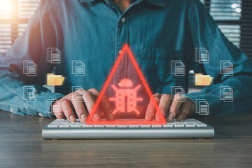 Person typing on keyboard with digital bug warning symbol, representing cybersecurity threats and data protection.