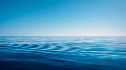 Fototapeta premium Calm open ocean surface with blue sky and horizon, ai generated