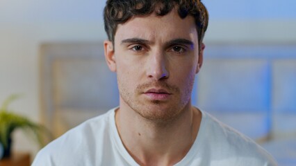 Serious Caucasian young man rejecting idea shaking head no refusal indoors European male guy...