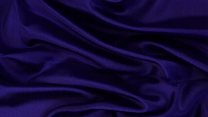 Luxurious purple satin unfolding in elegant waves with smooth texture
