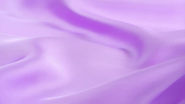 Soft lavender fabric moving elegantly in gentle waves and seamless flow