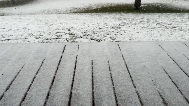 Snow Falling on Wooden Deck and Yard