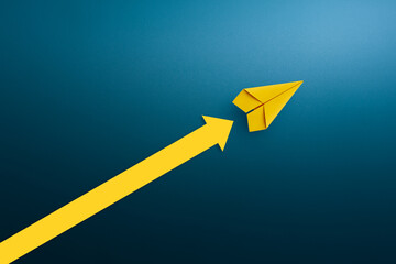 Yellow paper plane with arrow up, Success in business growth concept.