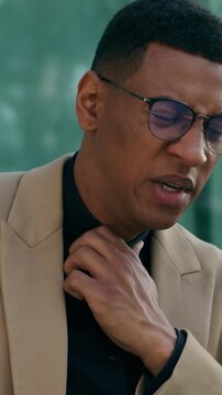 African American business man city street coughing sick suffering from pneumonia lung inflammation ill outdoors male entrepreneur businessman unwell fever cold flu throat pain medicine health problems