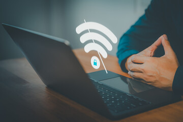Person using secure WiFi connection on laptop computer. Cybersecurity, private network, and encrypted internet access concept for remote work and digital safety.