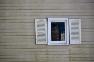 old white window with shutters