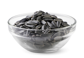 Sunflower seeds in a glass plate close-up on a white. Isolated