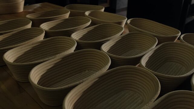 Close-up of bread proofing baskets on a bakery table. Bakery equipment.