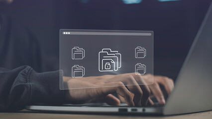 Typing on laptop with digital folder and lock icon overlay, representing confidential documents, secure data system, file access control, business information protection, and cybersecurity policy.