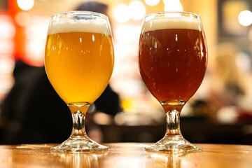 Two glasses of light and dark beer.