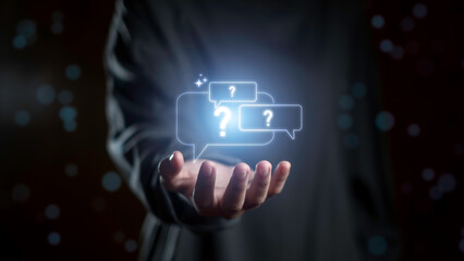 Open hand presenting glowing question mark icons inside chat bubbles, symbolizing inquiry, FAQ, curiosity, problem-solving, and digital communication for seeking knowledge and answers.