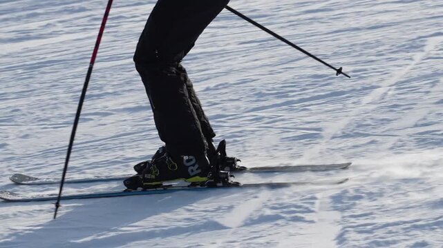 Skiing techniques demonstrated on snowy slopes at noon