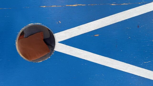 Bean Bags Shot into a Corn Hole Board Shot From Above