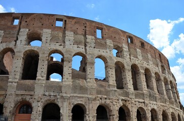 Obraz premium Rome, Italy 09.02.2019: Colosseum (Coliseum) is one of main travel attraction of Rome, Italy. Ancient Roman ruins of Colosseum, landscape of old Rome city, Italy.