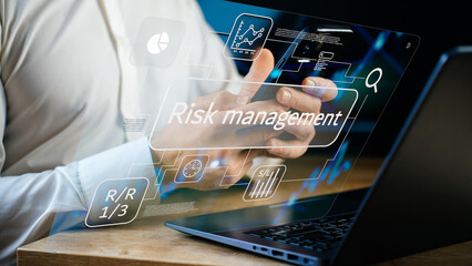 Risk management and strategic decision-making concept, digital interface with analytics, performance indicators, forecasts, risk reward and stop loss tools, man analyzing charts