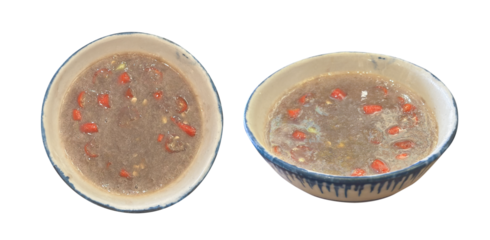 Shrimp paste with sliced lemongrass and chilli Sauce. Shrimp paste chili paste in white bowl. Mam tom bun dau