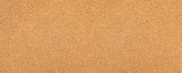 Cork board surface providing natural brown texture background