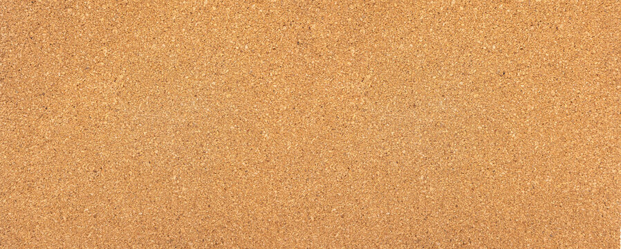 Cork board surface providing natural brown texture background