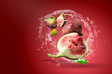 Water splashing on Fresh figs over red background