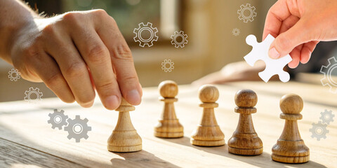 Abstract business background. Hands holding a wooden mannequin in the concept of leadership and planning to strategically build a work team