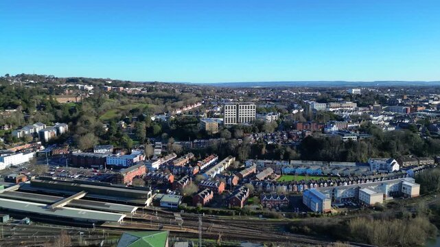 Exeter, South Devon, England: DRONE VIEWS: Exeter city centre showing Exeter St David's railway station (f/g), houses and commercial properties. Exeter is the county town of Devon.