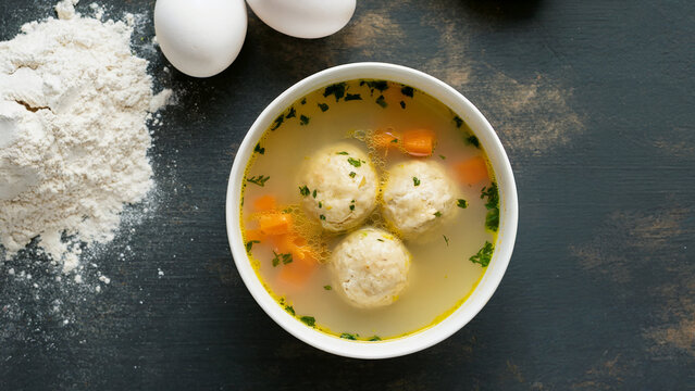 Top View of Traditional Jewish Matzah Ball Soup with Eggs and Flour