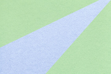Abstract geometric light green paper background with pastel blue ray, macro texture for banner, template, presentation