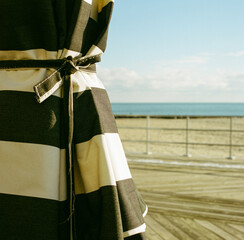 Black and white striped beach umbrella