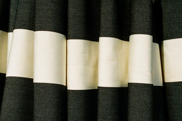 Black and white striped beach umbrella