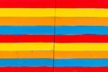 Bold horizontal stripes in vibrant colors create an eye-catching display on a sunny day