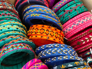 Indian colorful bangles displayed in local shop in a market of Pune, India, These bangles are made of Glass used as beauty accessories by Indian women.