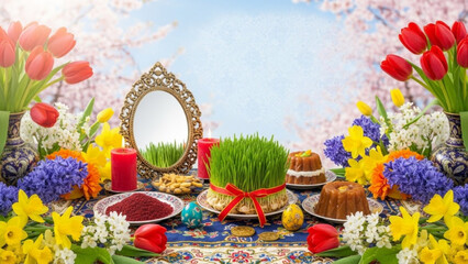 Fototapeta premium A vibrant and colorful Nowruz celebration setup with flowers, candles, and traditional foods on a decorative tablecloth.