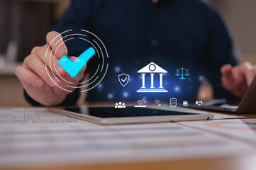 Businessman using computer laptop and digital tablet working in home office with virtual icons correct tick mark in Document approval concept, checklist, certification, quality control