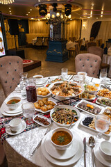Top view of richly set table with assorted dishes in luxurious restaurant