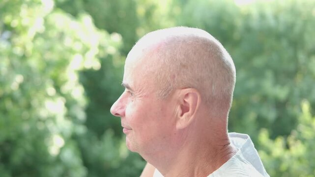 close-up of mature charismatic man, senior 60 years laughs merrily, smiles openly, rejoices at good news, wrinkles on face, overhang, concept human health, good mood, optimism
