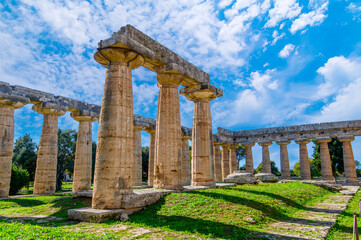Fototapeta premium The ancient Greek temple of Hera in Paestum, Italy. Famous archaeological site of Paestum, Magna Graecia, ancient ruins.